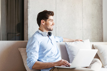 Smiling young man with headphones