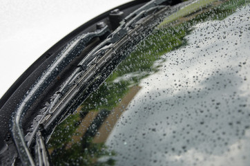 drops of water on the mirror of car.