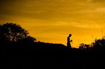 Fototapeta premium man taking photos of sunset .