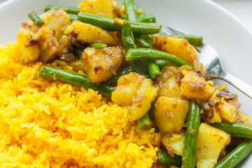Potato and green bean curry with yellow basmati rice