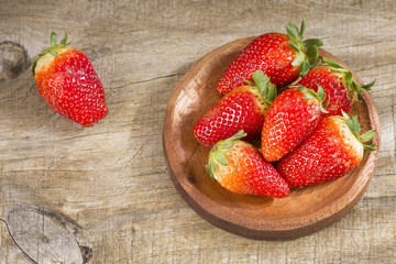 Strawberries in a wooden bowl. Fresh and nice strawberries - Fragaria
