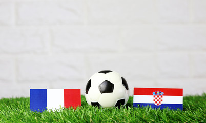 ball with France VS Croatian flag match on Green grass football 2018