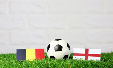 ball with Belgium VS England flag match on Green grass football 2018