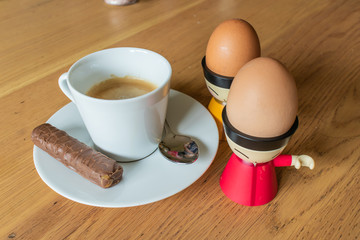 Breakfast of Espresso, Soft Boiled Eggs and Chocolate Bar