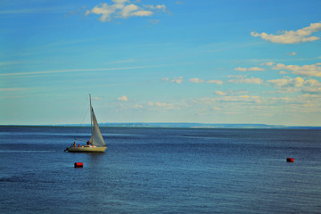 Fototapeta premium Sailing boat floats on water.