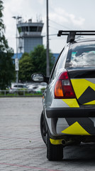 Fototapeta premium Rear light with yellow turn signal on silver car