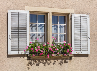 Fototapeta na wymiar Window of an old house in central Europe