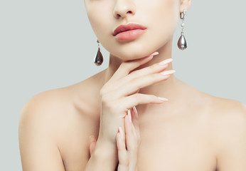 Obraz na płótnie Canvas Perfect Female Lips, Manicure Hands and Jewelry Earrings