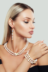 Beautiful Woman with Makeup, Long Healthy Hair and Jewelry