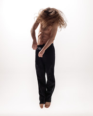 Young beautiful dancer posing in the studio