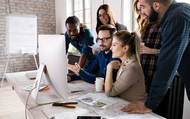 Young architects working on project in office