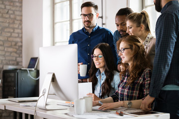 Young architects working on project in office