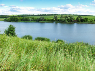 csenic view of counrtyside, valley and a field