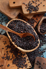 Black rice in a bowl with a spoon