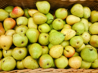 Green apples on the counter in the supermarket.