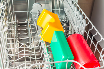 Childrens toys lie in the dishwasher