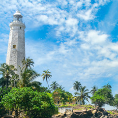 Fototapeta na wymiar Beautiful lighthouse, lagoon and tropical palms (Matara Sri Lanka).