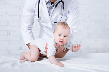 pediatry concept - little baby patient with doctor pediatrician