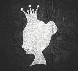 Profile view silhouette of a princess or queen. Cute adolescent girl portrait. Fashion branding emblem