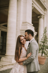 Young wedding couple on Capitoline hill in Rome