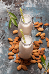 Almond milk on a turquoise background