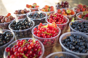 glasses with different berries-strawberries, currants, blueberries, gooseberries, raspberries