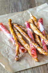 Breadsticks wrapped in jamon