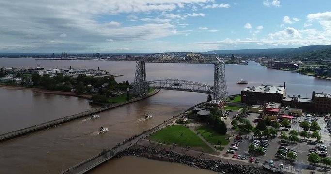 Aerial of Boats passing through Lifting Bridge - Duluth, MN, USA