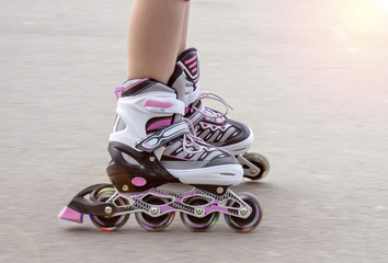 Girl on roller skates riding outdoors	