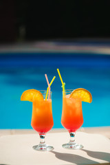 Cocktails on the background of the pool