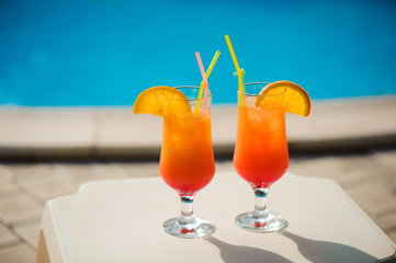 Cocktails on the background of the pool