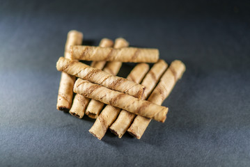 delicious cream filled wafers on the black background