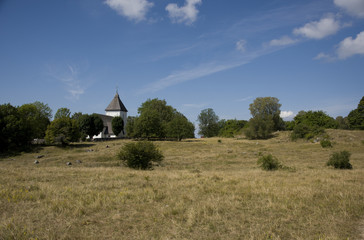 Adelsö church with grave field with larger viking burial mounds from 1 000s Ekerö, Stockholm