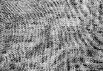 Old vintage linen cloth textile. Burlap rustic tumbled texture background.