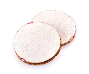 taro roots on white background