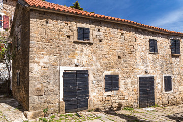 Ancient houses on a stone street in Groznjan village, Istria, Croatia, Europe.