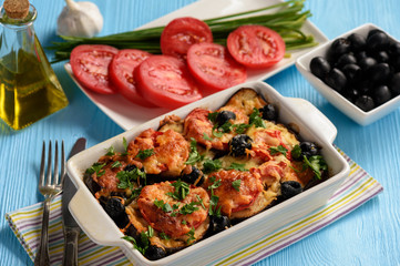 Eggplant casserole with mozzarella , tomatoes and olives.