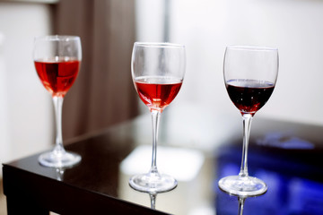 Glasses of wine red standing on a table