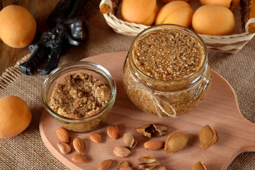 Urbech of apricot kernel in a glass jar. National Dagestani paste of nuts