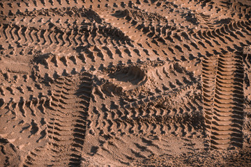 Tyre tracks on sand, traces, industrial background