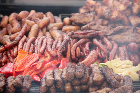 Romanian mixed grill with beef, pork, chicken and traditional thin sausages sold on a street food stall