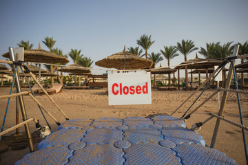 Closed passage to swimming area on summer tropical beach. Horizontal color photography.