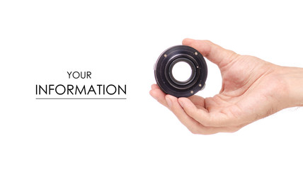 Lens objective in hand pattern on white background isolation