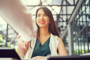 close up businesswoman handshake with partner,ceo leader hand shake for agreement or approve or...