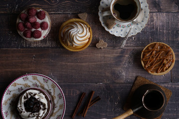 Cup of coffee, coffee pot and cakes, flatlay