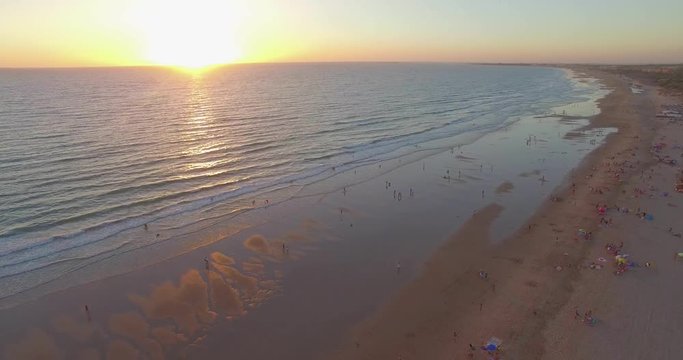 Aerial - Beatiful beach with sun umbrellas and beach restaurant