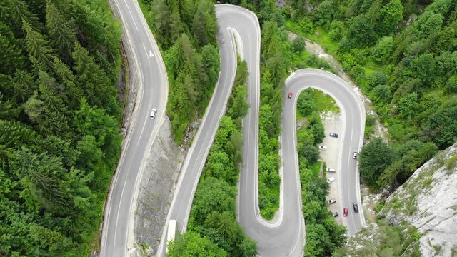 curved road with cars and beautiful forest landscape. Bicaz gorges, Romania. Aerial view from drone