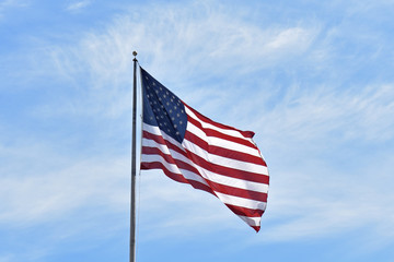 American Flag against Bright Blue Sky