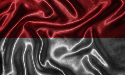 Obraz premium Wallpaper by Indonesia flag and waving flag by fabric.