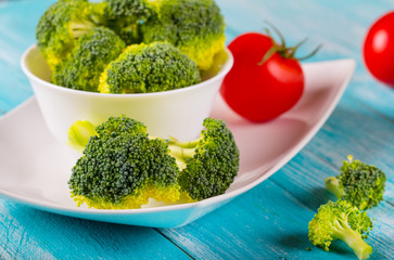 broccoli vegetables vitamins green wooden background
